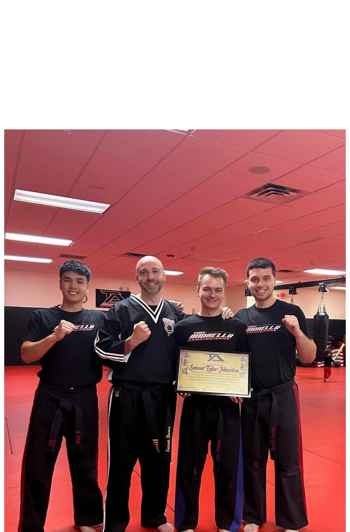 Team Andrello instructors celebrating a student's achievement